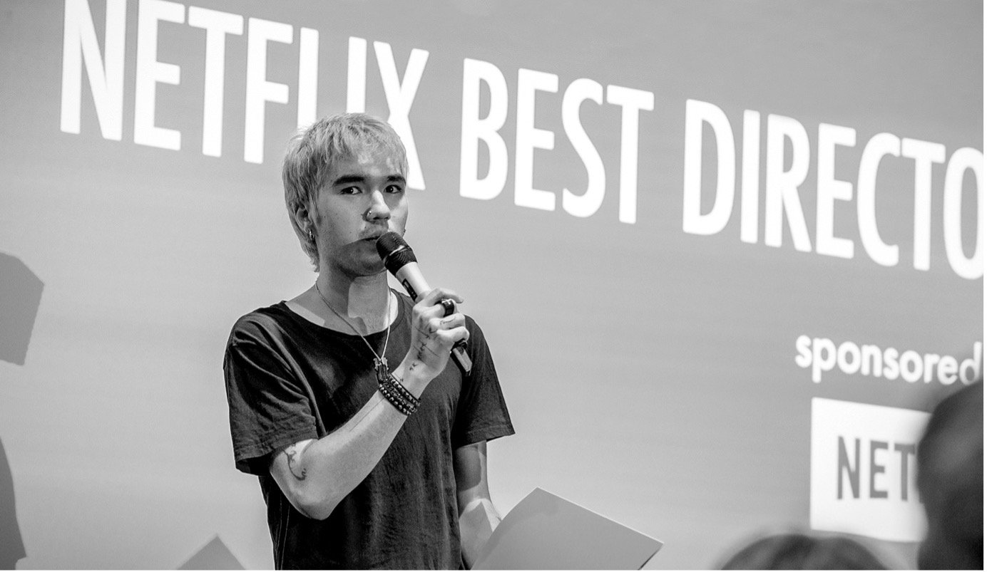 Oliver on stage accepting his award.