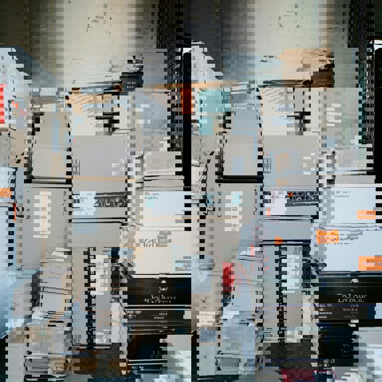 A large pile of shipping boxes. Picture: Claudio Schwarz/Unsplash