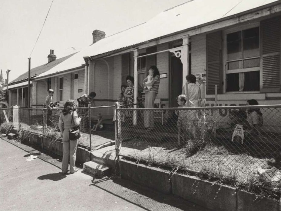 Women and children gather outside Elsie Women’s Refuge