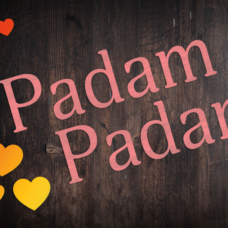 Pink Padam Padam with rainbow hearts on dark wooden board
By Bryony Adobe Stock