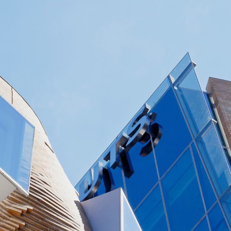 Looking up at UTS Business School building and sky