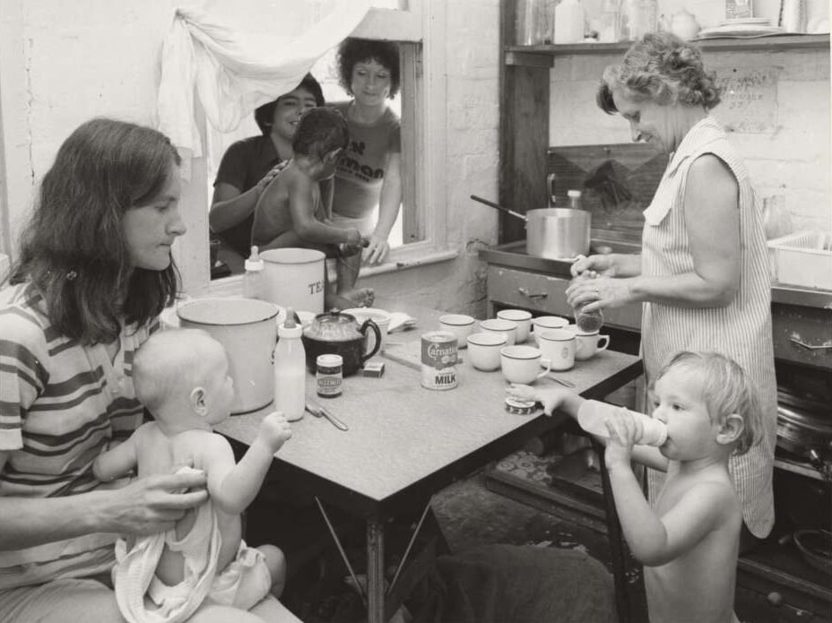 Women and young children gathered in the kitchen at Elsie Women’s Refuge, Sydney.