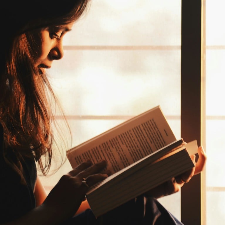 A young woman reading a book. Picture: Rahul Shah/Pexels