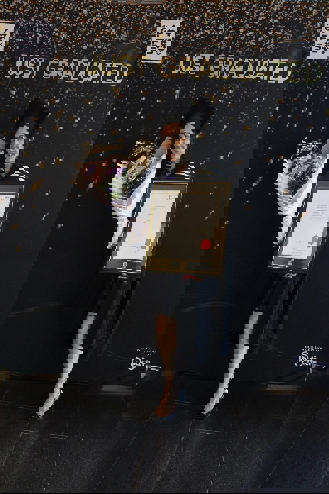 Photo of Margaret Hanania with a bunch of flowers and her JD certificate