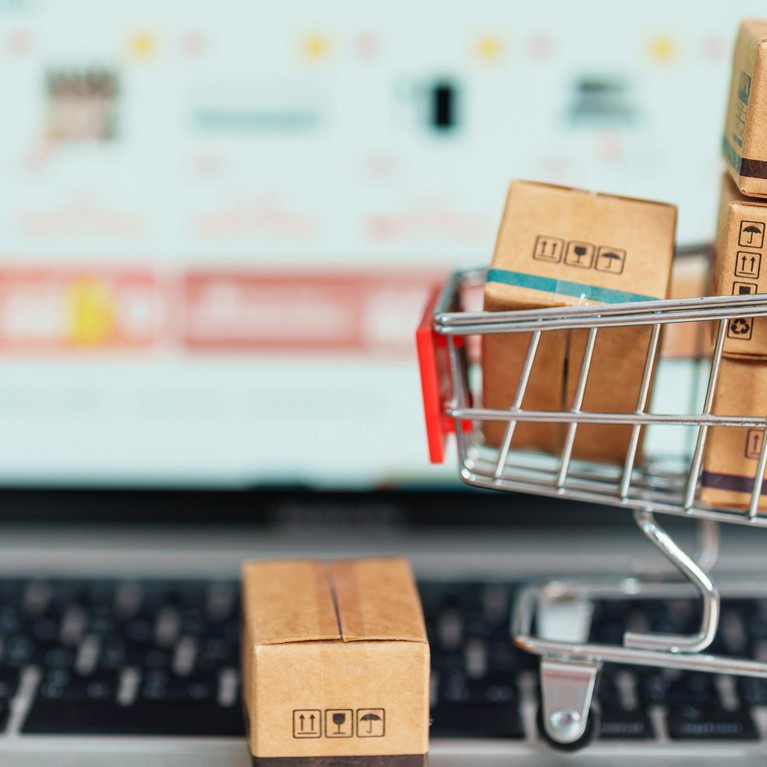 Boxes with shopping cart on a laptop computer