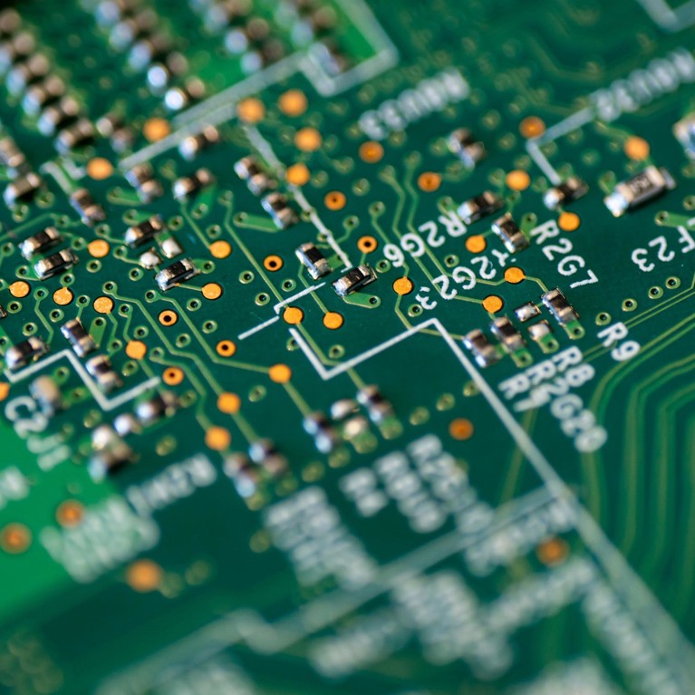Close range view of a green and white circuit board