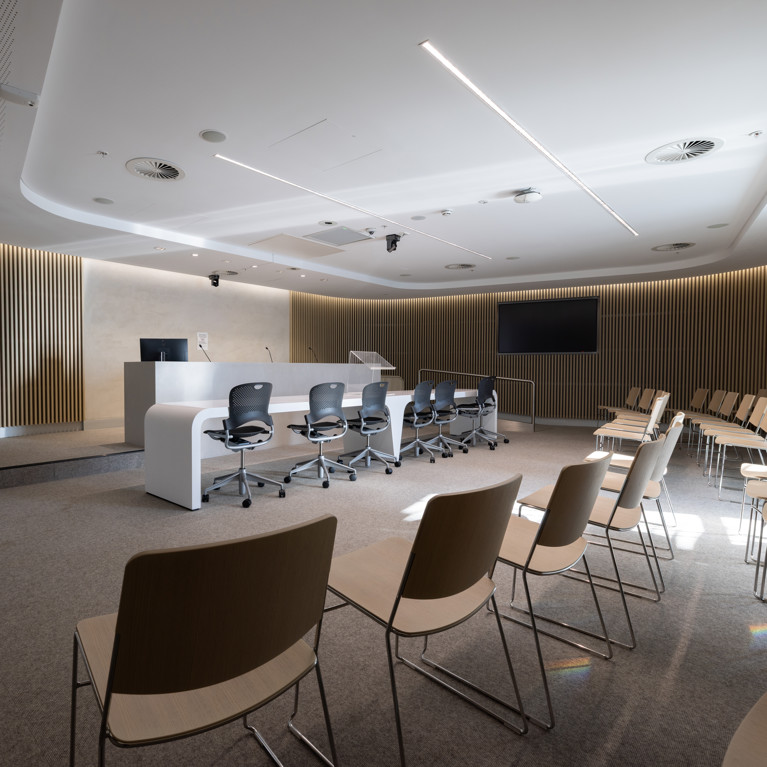 Sir Gerard Brennan Moot Court is shown, including the judge's bench, bar table, video screen and the public gallery