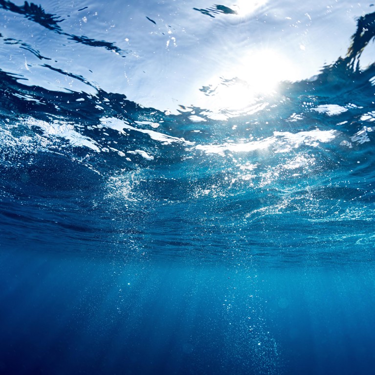 Blue ocean surface seen from underwater