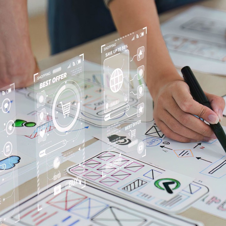 Close up ux developer and ui designer brainstorming interface wireframe design