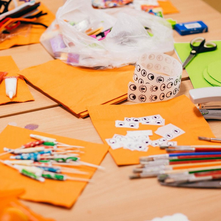 Arts and crafts supplies on a desk