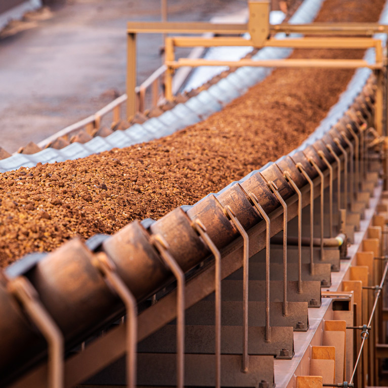 Conveyor belt moving iron ore. Picture: John/Adobe Stock
