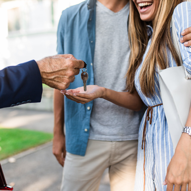 Young happy couple talking with real estate agent and buying a new house.
By hedgehog94 Adobe Stock