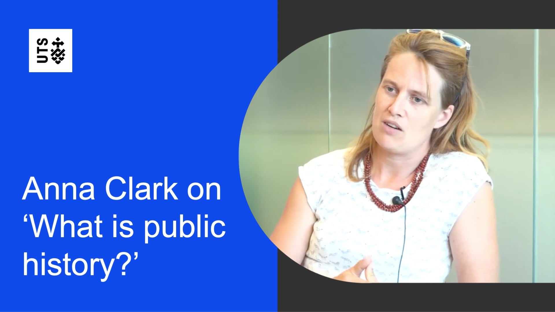 Anna Clark speaking in an interview, with the UTS logo and the title “Anna Clark on ‘What is public history?’” displayed on a blue background.