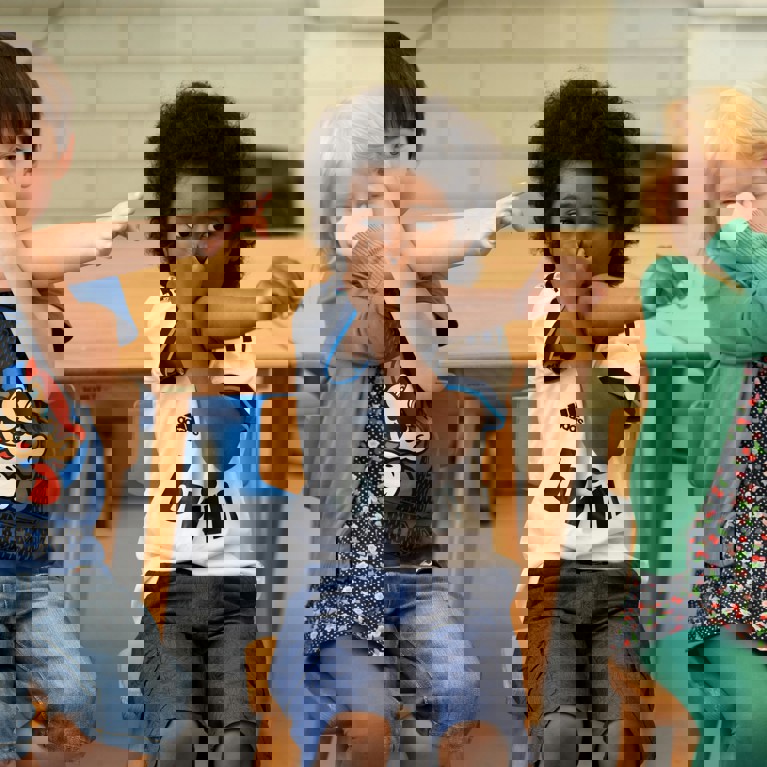 Three children sitting side-by-side holding their breath. Picture: Arthur Krijgsman, Pexels