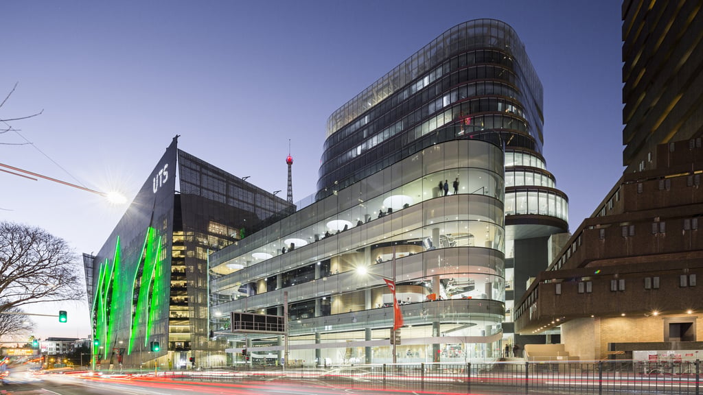 The University of Technology Sydney Central, Tower and the Faculty of Engineering and Information Technology buildings as seen from the street in the early evening.