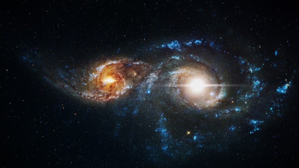 Two galaxies merging in space.