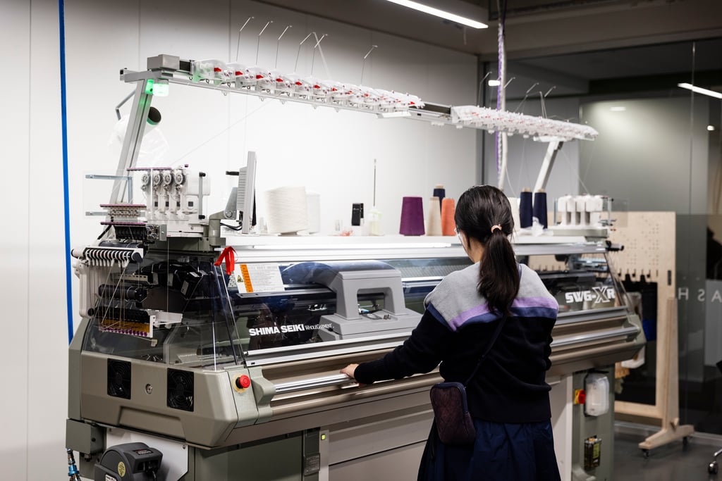 A student using the Shima Seiki knitting machine.