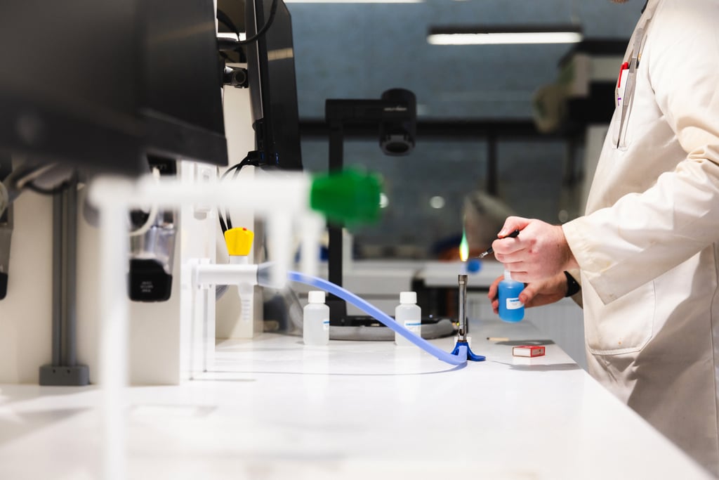 person using a bunsen burner in a University of Technology Sydney science lab