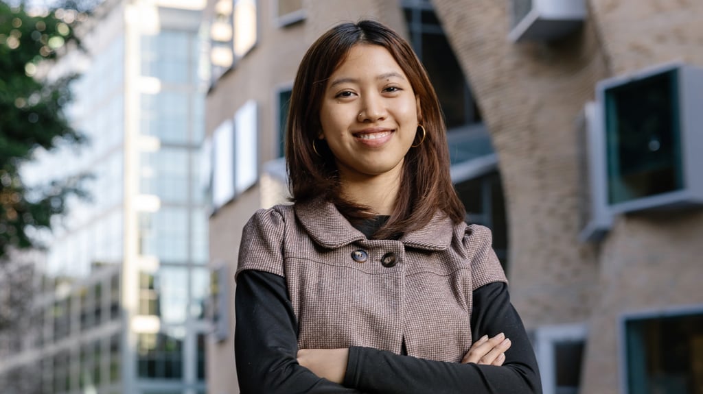 Image of person smiling with arms crossed