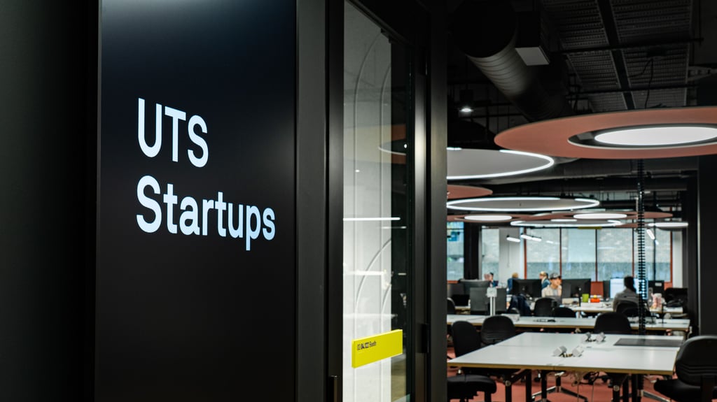 UTS Startups co-working space, with a large digital sign that say "UTS Startups" in the foreground