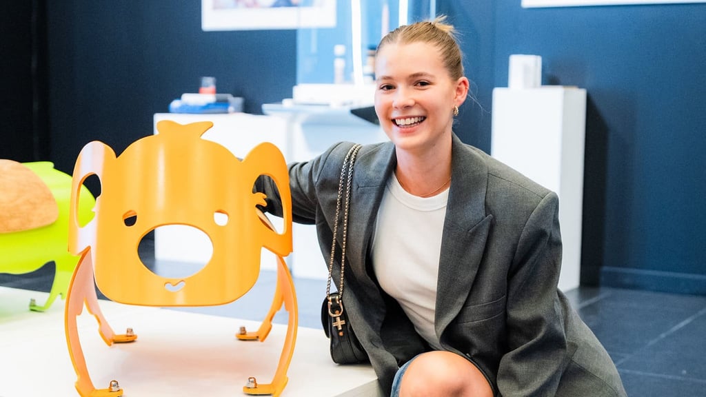 Luisa Skyring alongside an orange koala, one of her street furniture pieces
