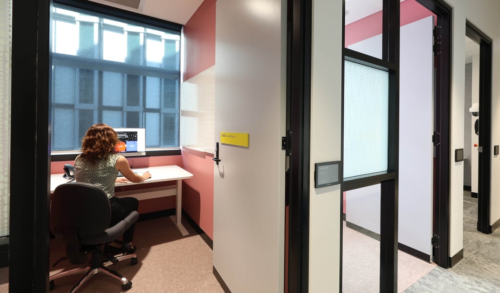 A person works on a computer in a quiet room on the UTS campus.