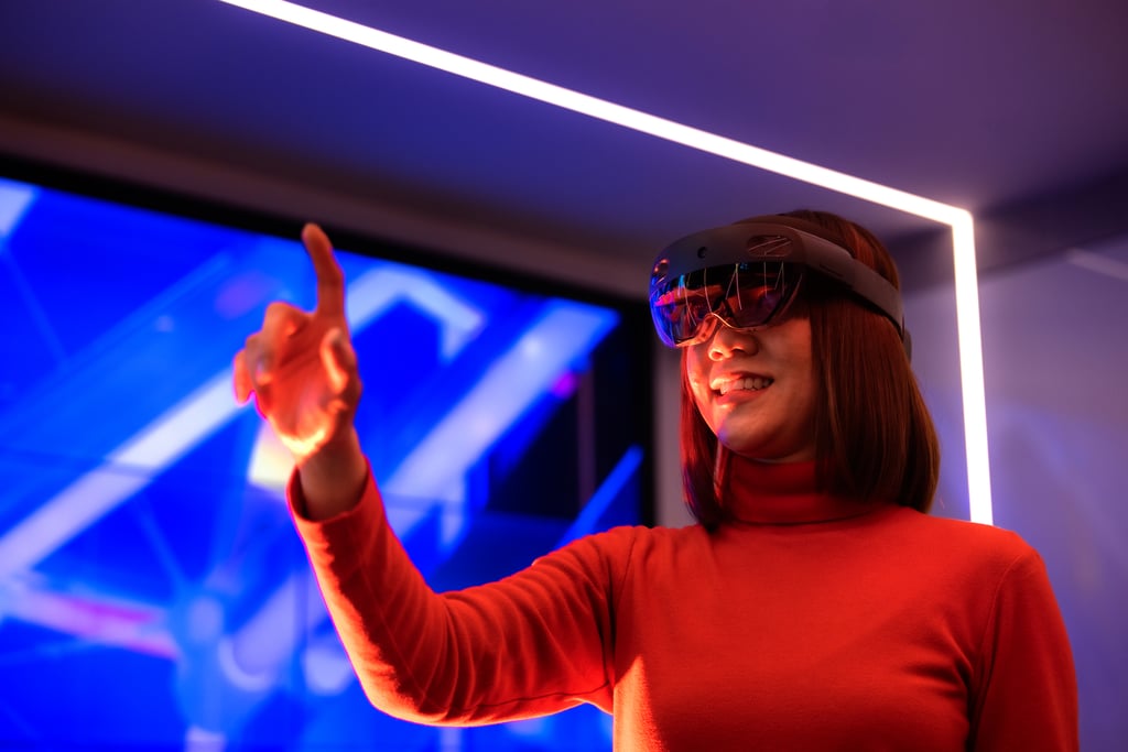 Female student using virtual reality headset in the UTS Data Lounge.