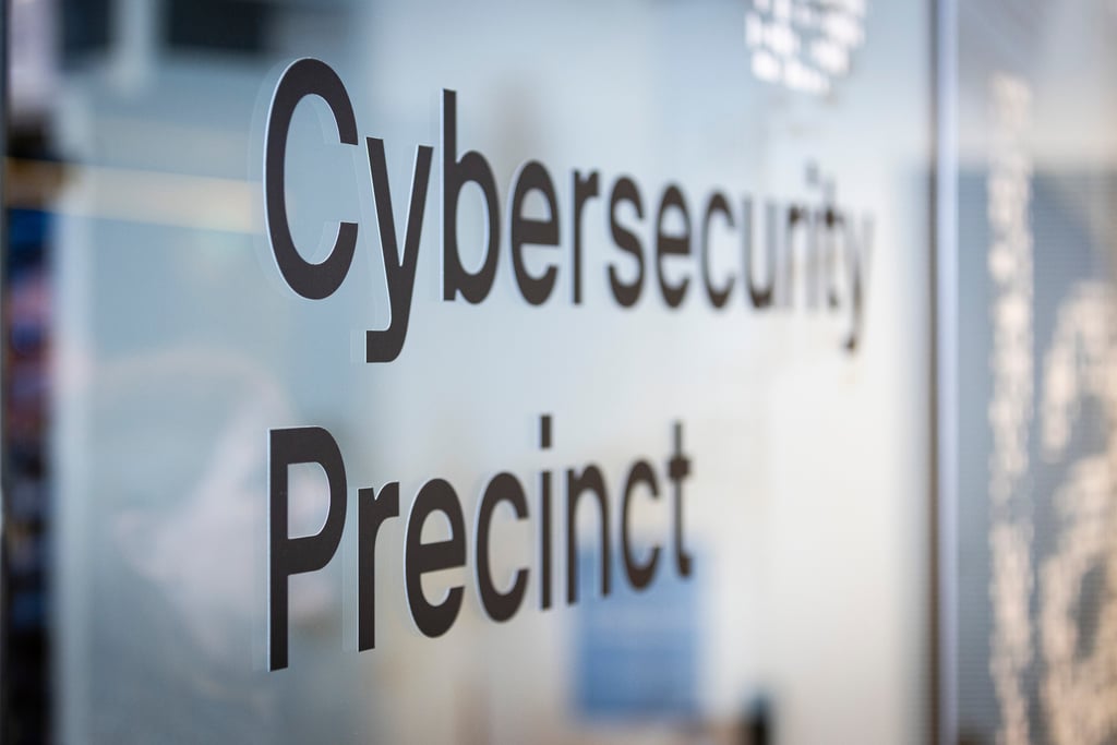 Sign on a wall that says "Cybersecurity precinct"