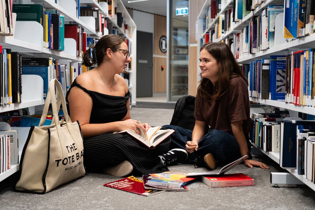 Ellen Armfield in library with friend