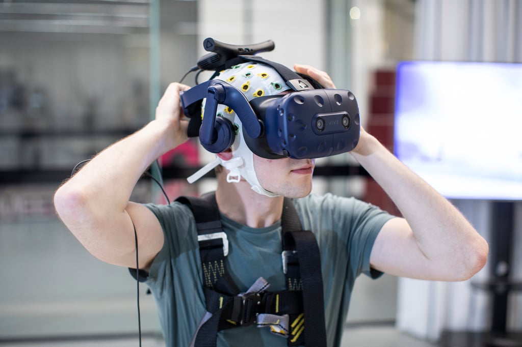 A researcher wearing VR goggles at the UTS Tech Lab.