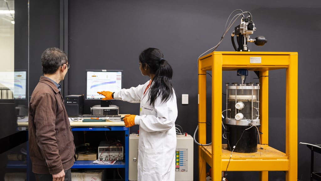 University of Technology Sydney Transport Research Centre staff in lab showcasing machinery and research.