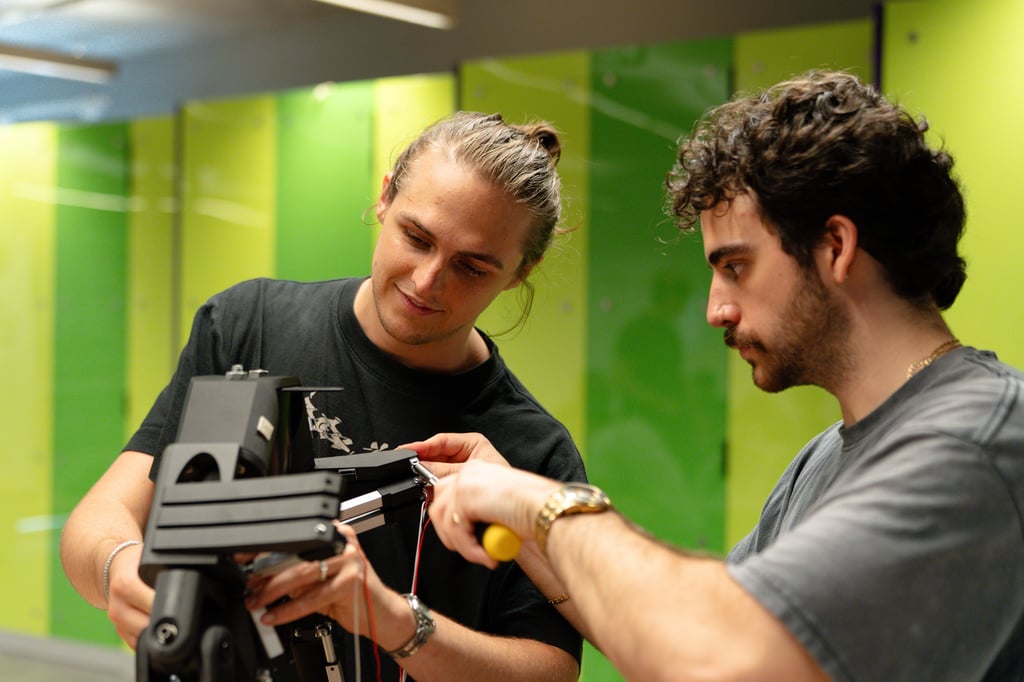Two man working on a robot