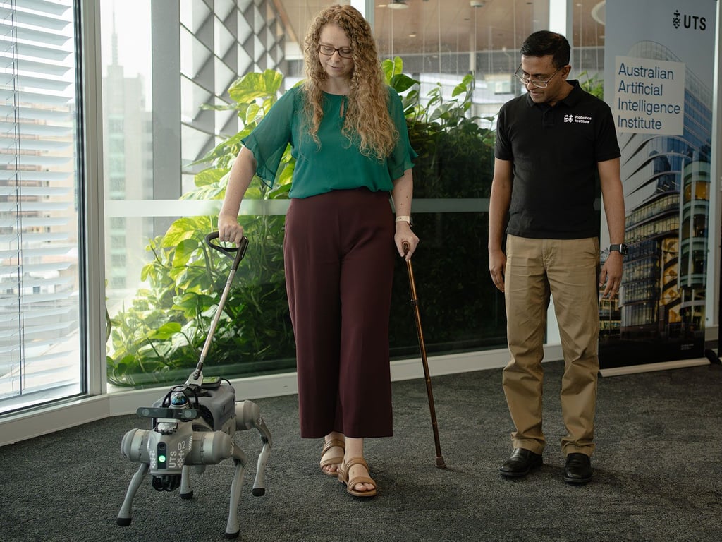 Jodi Martin tests the robotic guide with Sarath Kodagoda at the UTS Robotics Institute.