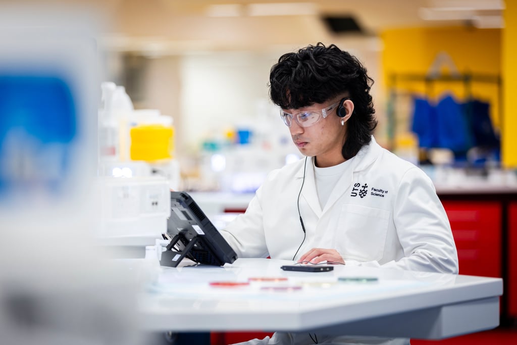 Student in the lab looking at computer.
