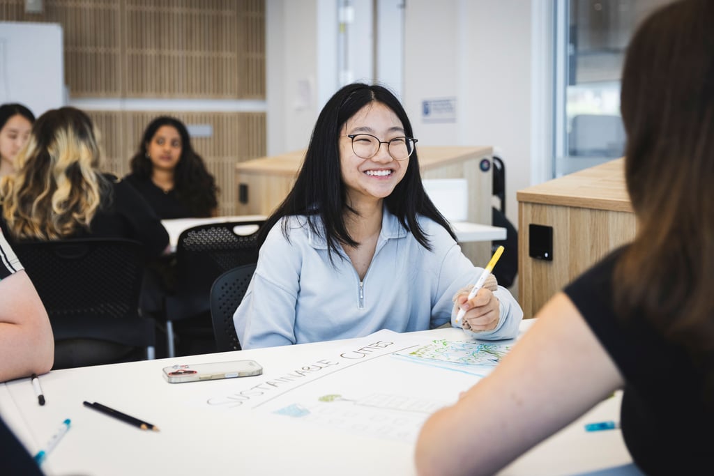 Student smiling in class.