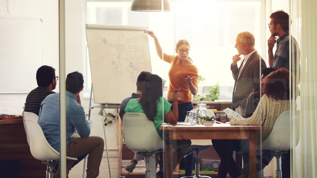 Shot of a group of coworkers in a boardroom meeting