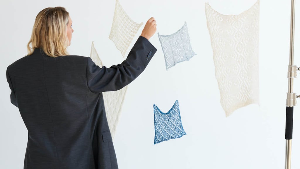 Cameron Hill (shown from behind) and her designs.