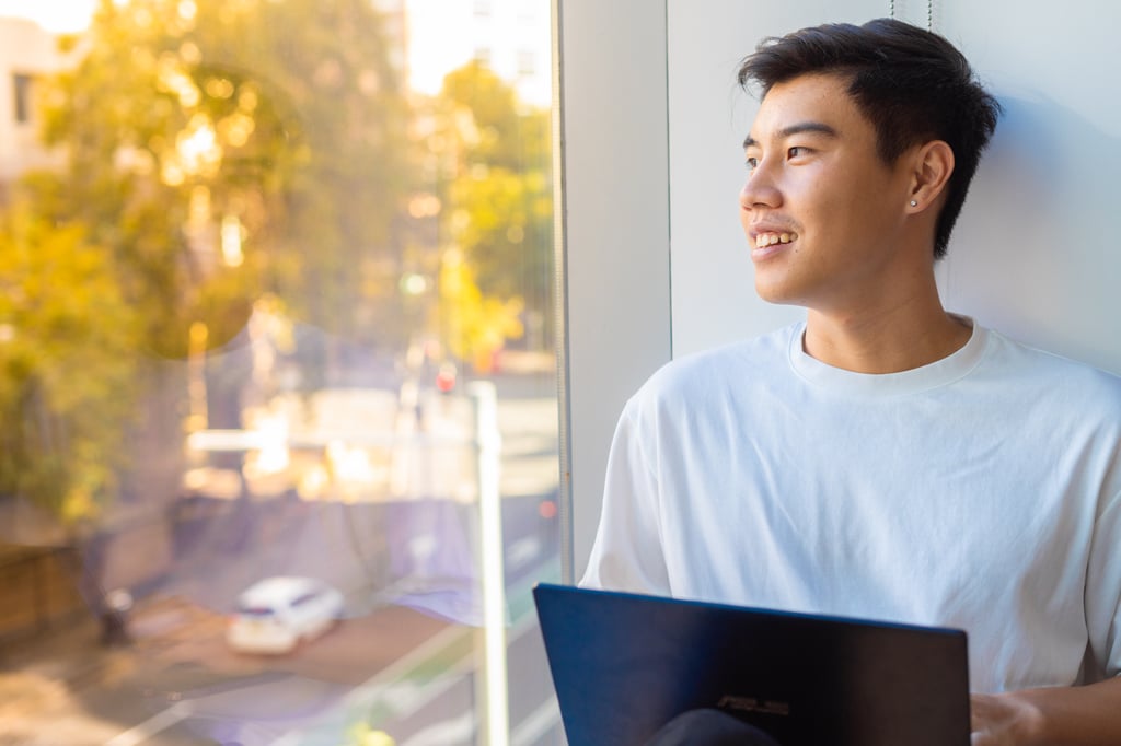 Student looking through window