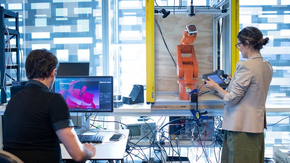 Rapido staff demonstrating robot technology.