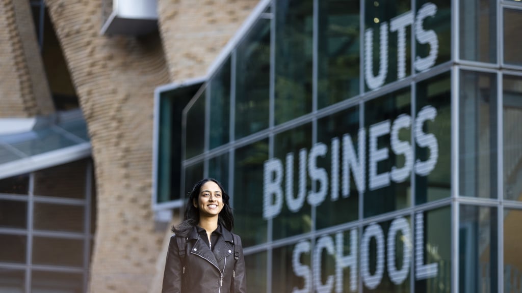 Student walking outside the UTS Business School.