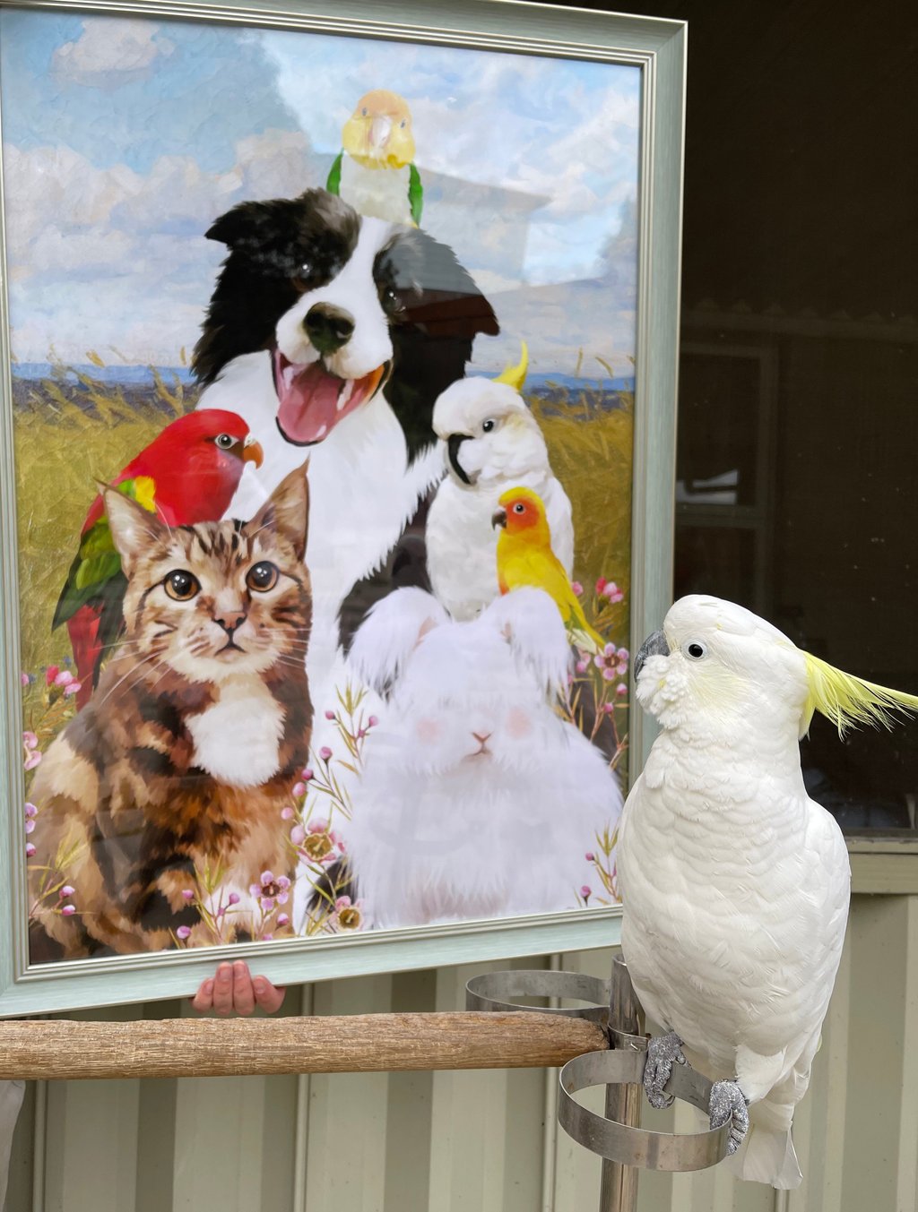 A cockatoo perched next to a painting of animals by Yuqing Wei.