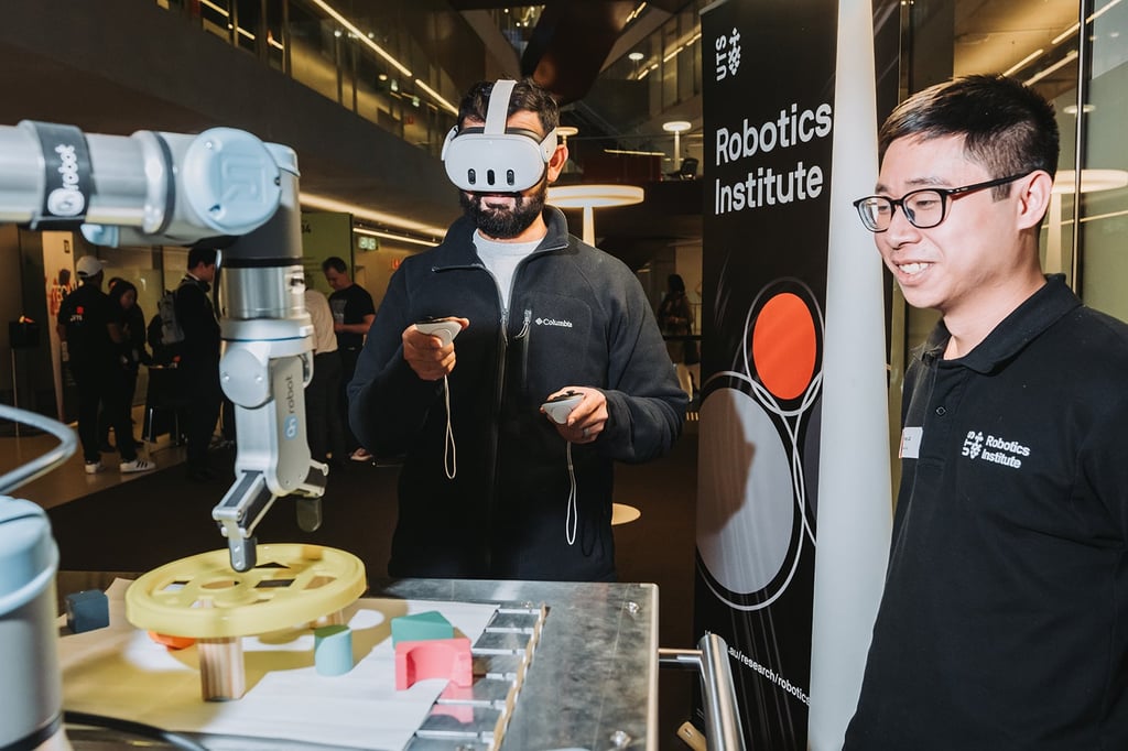 Student with VR goggles testing a robotic device