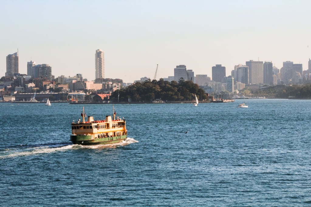 Ferry running between Manly and the Sydney city centre with on a clear summer day