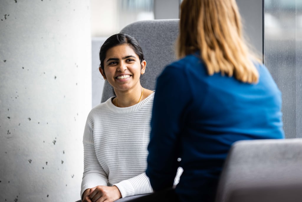 Undergraduate student smiling and chatting