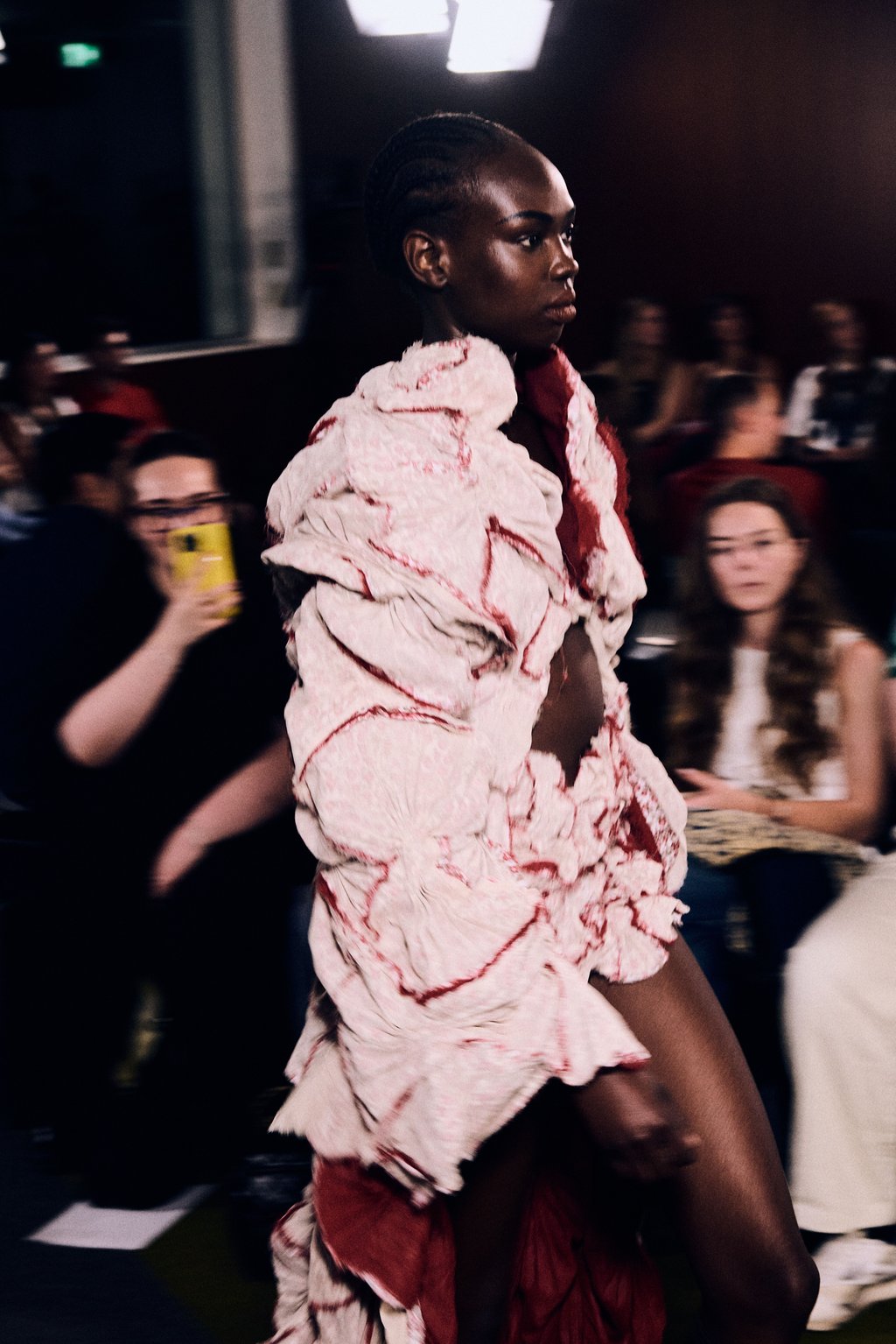 A model wears a fluffy pink jacket