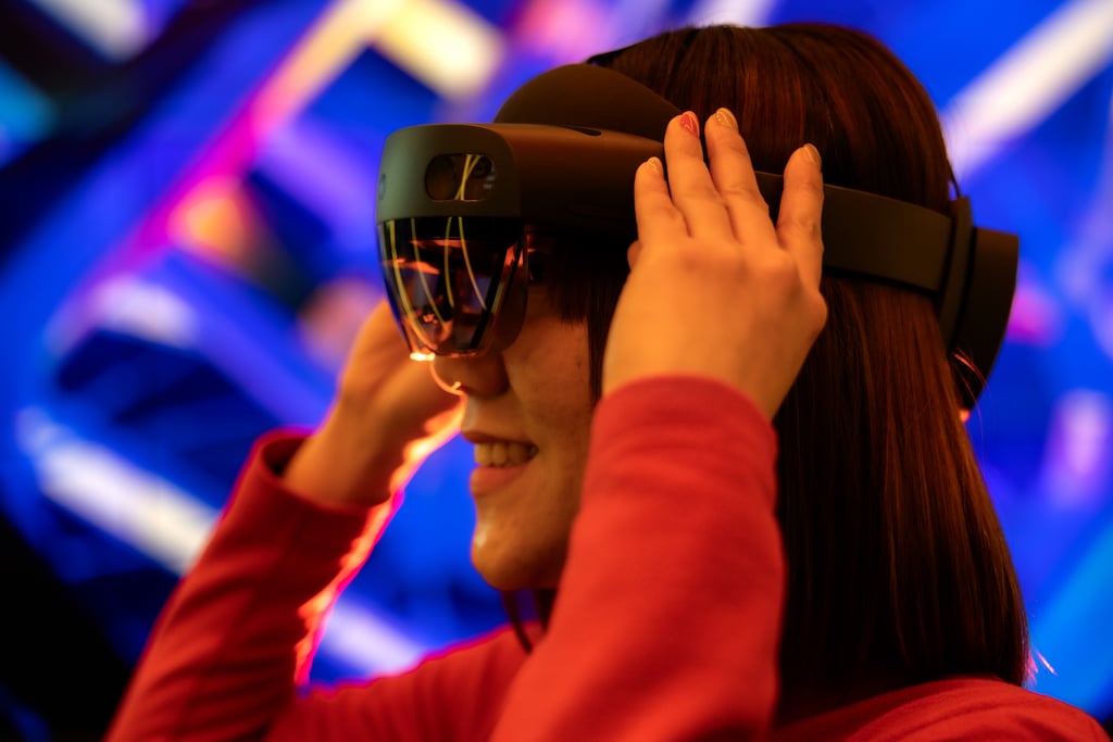 A woman using a 3D headset