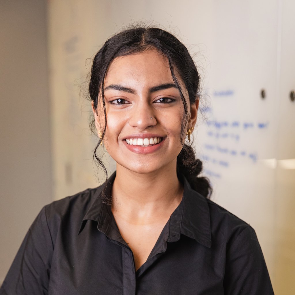 Person smiles towards camera