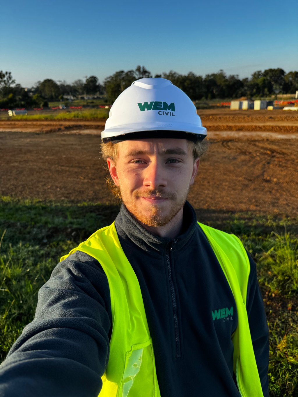 Man in hard hat in a field