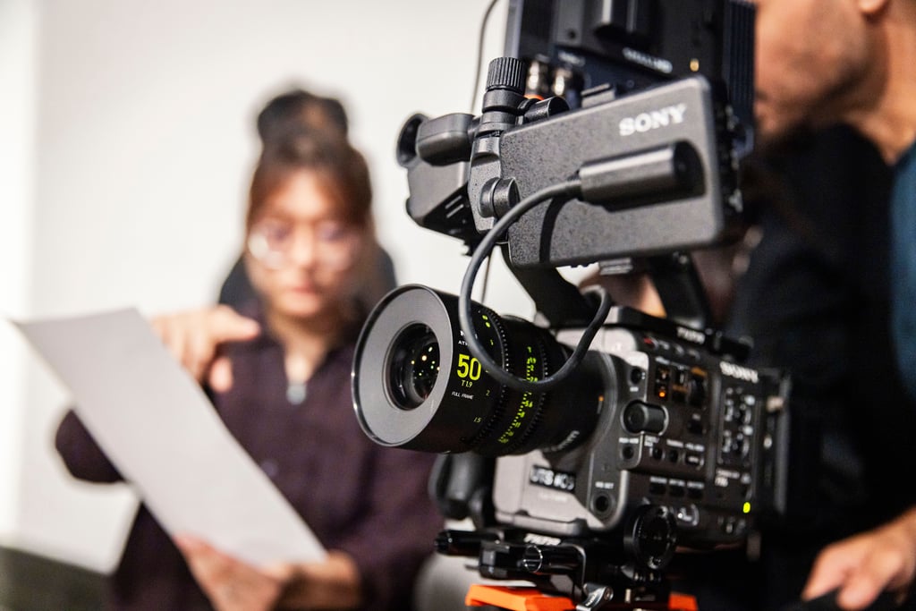 Two students filming in the Bon Marche Studio at the University of Technology Sydney