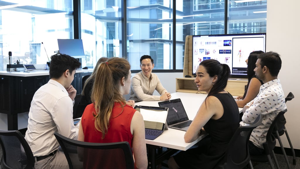 A group of professionals in a meeting room.
